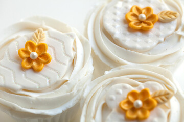Fototapeta na wymiar White and Gold Cupcakes