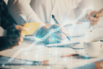 Fototapeta premium Double exposure of forex graph drawing over people taking notes background. Concept of financial analysis