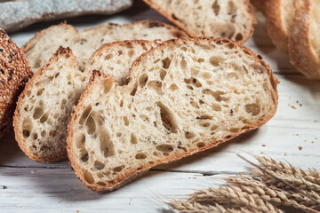 Various rustic bread on a wooden board. Healthy food and farming concept