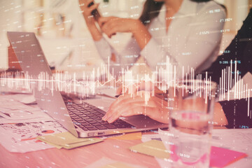 Multi exposure of woman hands typing on computer and forex chart hologram drawing. Stock market analysis concept.
