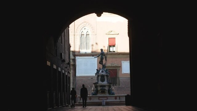 Bologna, Italy, the Fountain of Neptune views from the arcade
