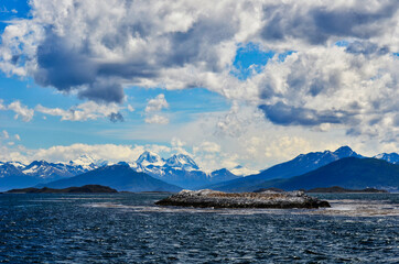 Bird Island Landscape of Beagle Channel in Argentina with Moutain Backdrop and Clouds
