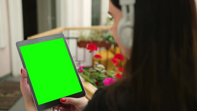 Business Female In The Cafe Works With Tablet Pc Video Calls. Mobile Working Outside Office. Young Lady. View Over Shoulder At Notepad. Close Up Woman Using Cell Pad, Garden. Green Screen, Texting