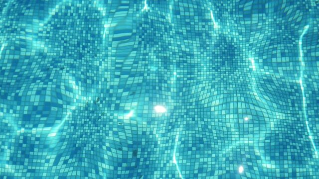 Light blue waves are playing with light in a tidy swimming pool on a sunny day