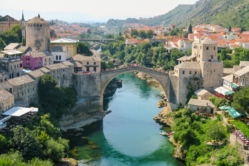 Fototapeta na wymiar Beautiful view of Mostar's old bridge and the Neretva river as seen from the minaret of Koskin-Mehmed Pasha's Mosque