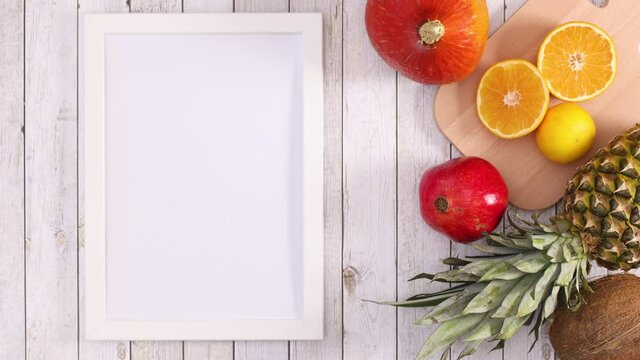 Empty frame for text appear next to tropic fruits. Stop motion 