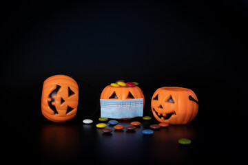 Three halloween pumpkins in times of pandemic