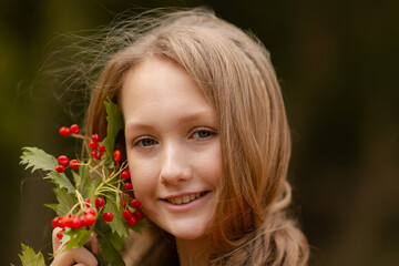 Cute teen girl falls in the woods with apple and ash