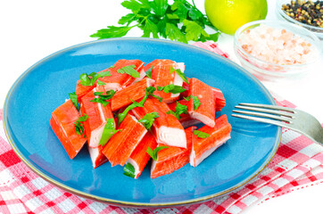 Crab sticks, surimi, imitation, snack on plate. Studio Photo