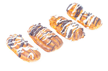 Iced custard cakes with cream, confectionery. Studio Photo