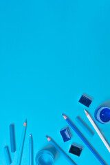 Artist workplace with tools on blue background