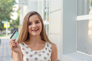 Cheerful female with credit card