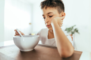 Child with poor appetite during the meal. Concept of lack of appetite.