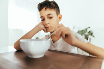 Child with poor appetite during the meal. Concept of lack of appetite.
