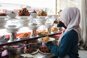 portrait young muslim woman who prepares the dish traditional food