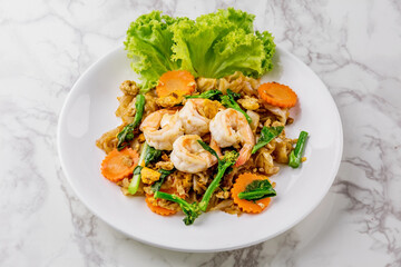 Stir-fried rice noodles with soy sauce and shrimp