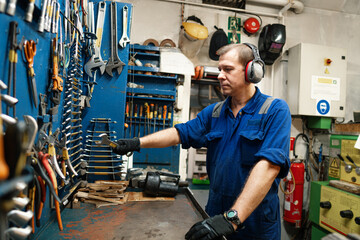 Marine engineer officer in engine control room ECR. Seamen's work.