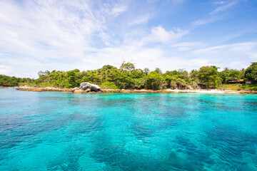 Nature and travel. Beach sea and blue sky with clouds background.