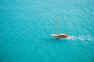 Fototapeta premium Ship in the blue sea