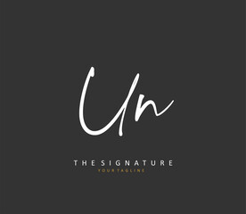 U N UN Initial letter handwriting and signature logo. A concept handwriting initial logo with template element.