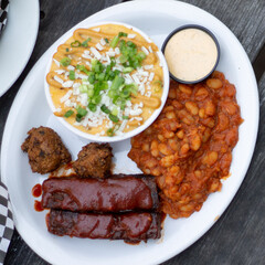 Vegan ribs, cheese grits and beans