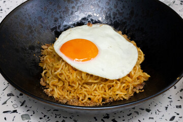 Salted egg yolk noodles with fried egg