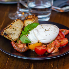 Burrata with sliced tomatoes and basil
