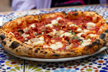 Woodfired pizza with vegan sausage and mushrooms