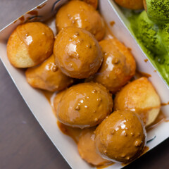 Donut balls coated in melted Biscoff