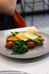 Eggs benedict on sourdough toast