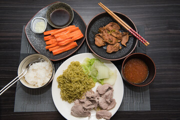 Asian oriental food composition, served on dark rustic background, top view. Thai cuisine set, japanese, chinese, korean.