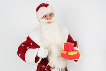 Santa Claus holds a gift in his hand, and the second makes a hand gesture - class. Isolated on white