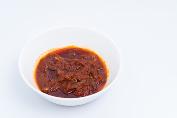 "Sambal ikan bilis" suitable for nasi lemak or nasi impit Asian Inspirations, Stir-Fried Anchovies with hot chilies. A white background provides copy space to the right.