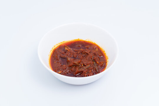 "Sambal ikan bilis" suitable for nasi lemak or nasi impit Asian Inspirations, Stir-Fried Anchovies with hot chilies. Food photography. Center of frame