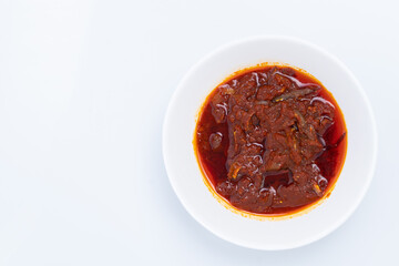 Top angle of "Sambal ikan bilis" suitable for nasi lemak or nasi impit Asian Inspirations, Stir-Fried Anchovies with hot chilies. A white background provides copy space to the left.