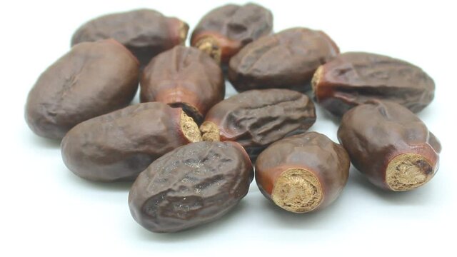 Lychee seeds on white background