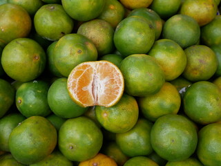 fresh tangerines for sale on food market.