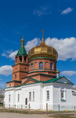 Fototapeta na wymiar Orthodox Church against the blue sky with clouds