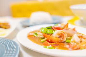 Stir Fried Sator beans with Shrimp on white plate.Thai food.  Copy space.