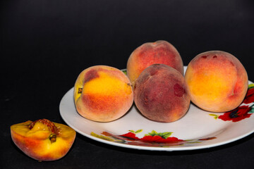 Fototapeta na wymiar peaches on a plate