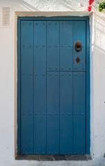 BEAUTIFUL STRONG BLUE DOOR TYPICAL OF THE WHITE VILLAGES OF ALMERIA