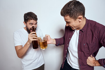 Two friends drink beer leisure fun alcohol friendship lifestyle light background