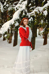 Beautiful portrait of young woman in red sweater, white scarf and gloves in frosty winter park. Winter style and holidays.	