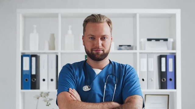 Professional medical doctor in hospital office, Portrait of young and confident physician.