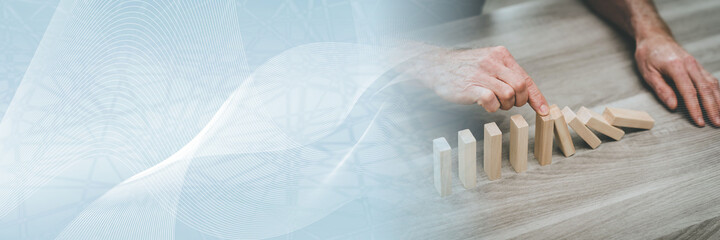 Concept of business control by stopping domino effect; panoramic banner