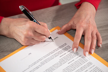 Businesswoman signing a document