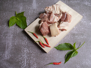 meat and spices on wooden board