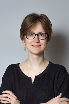 Portrait Of 30 Year Old Brown-haired Woman With Glasses