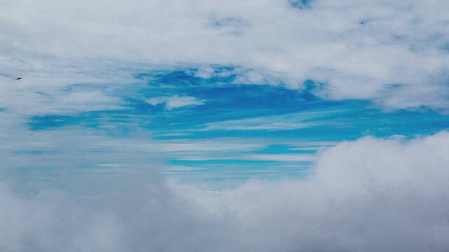 White clouds in the blue sky during the day time.cloud cloudscape timelapse. blue sky time lapse. Nature weather blue sky. White clouds background. Cloud time lapse nature background
