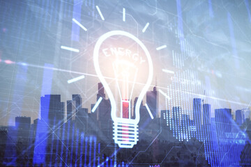 Multi exposure of bulb hologram drawing and cityscape background. Concept of idea.